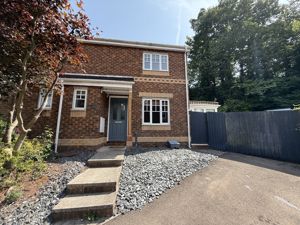 Front elevation and parking - click for photo gallery